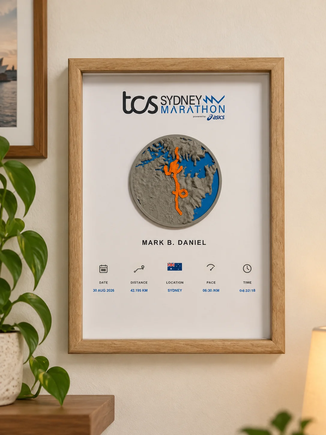 Example Sydney Marathon keepsake in a natural wood frame, with personalised poster and raised orange route.